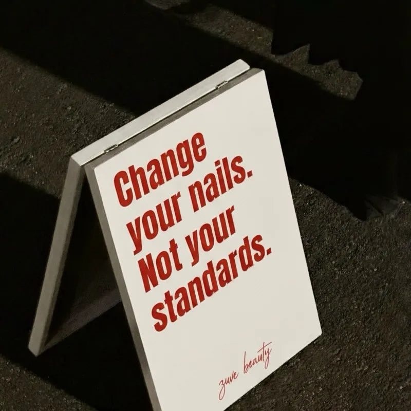 Small mirror with red text on a black background